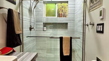 Shower, hair dryer, towels, soap