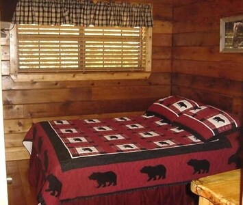 Main bedroom with queen size bed, dresser and nightstand