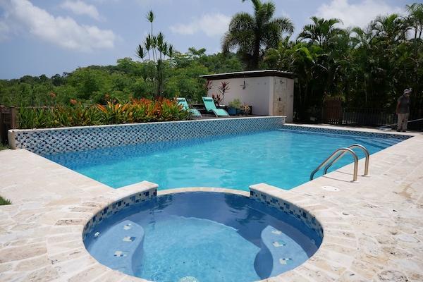 Pool and spa, with sun deck and coastal mountains in view