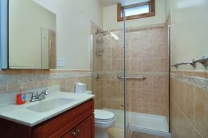 Shower, hair dryer, towels, toilet paper