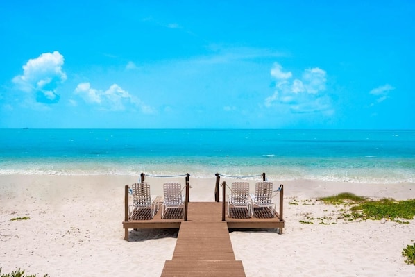 On the beach, sun loungers, beach towels