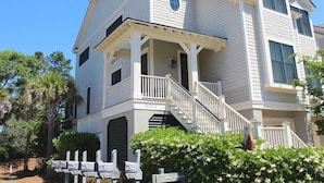 A two-story house with a porch, a staircase, and a mailbox. - Designer Saltmarsh Townhome! Neighborhood Pool! Great Location! Amenity access included! (Seabrook Island)