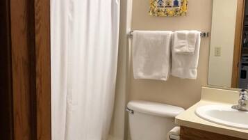 Combined shower/tub, towels, soap, shampoo
