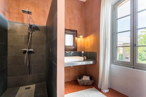 Bathtub, hair dryer, towels, soap