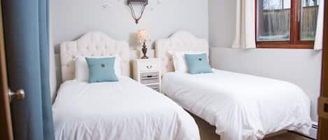 2 bedrooms, desk, blackout curtains, iron/ironing board