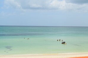 On the beach, sun loungers, beach towels