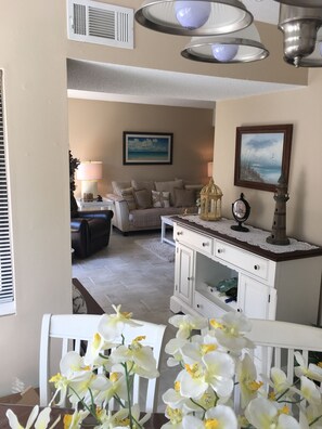 Flat-screen TV, DVD player, books, stereo