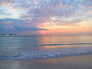 On the beach, sun-loungers, beach towels