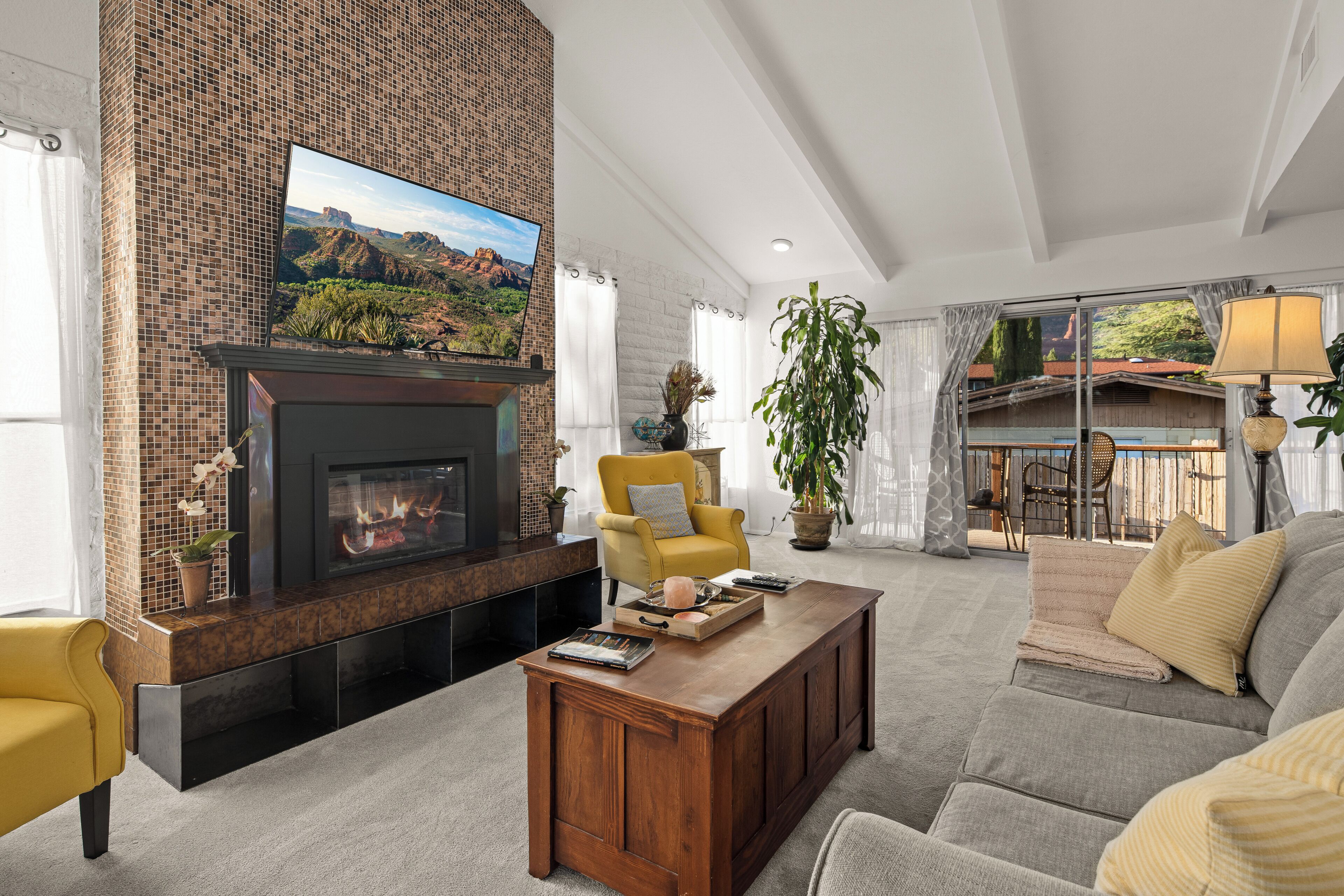 Smart TV, fireplace, books, printers