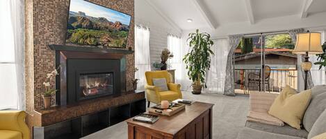 Smart TV, fireplace, books, printers