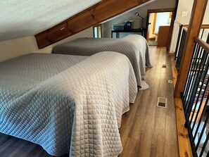 Watch your head in the cozy loft bedroom. View into the 1/2 bath. - looking for some peace and quiet? You'll find no better place at the Lake. (Sunrise Beach)