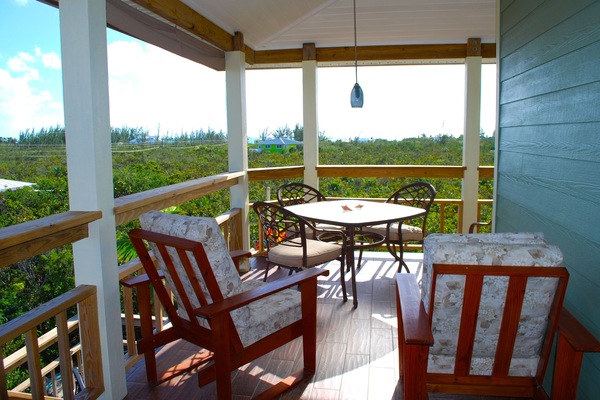 Patio with gas grill and seating, not to mention views.