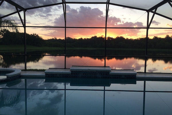 view of sunrise from bedroom, family room, kitchen and living room