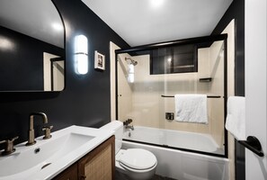 Combined shower/tub, hair dryer, towels, soap