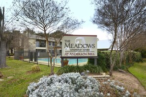 Enjoy a tranquil retreat surrounded by mature trees and a well-maintained lawn.