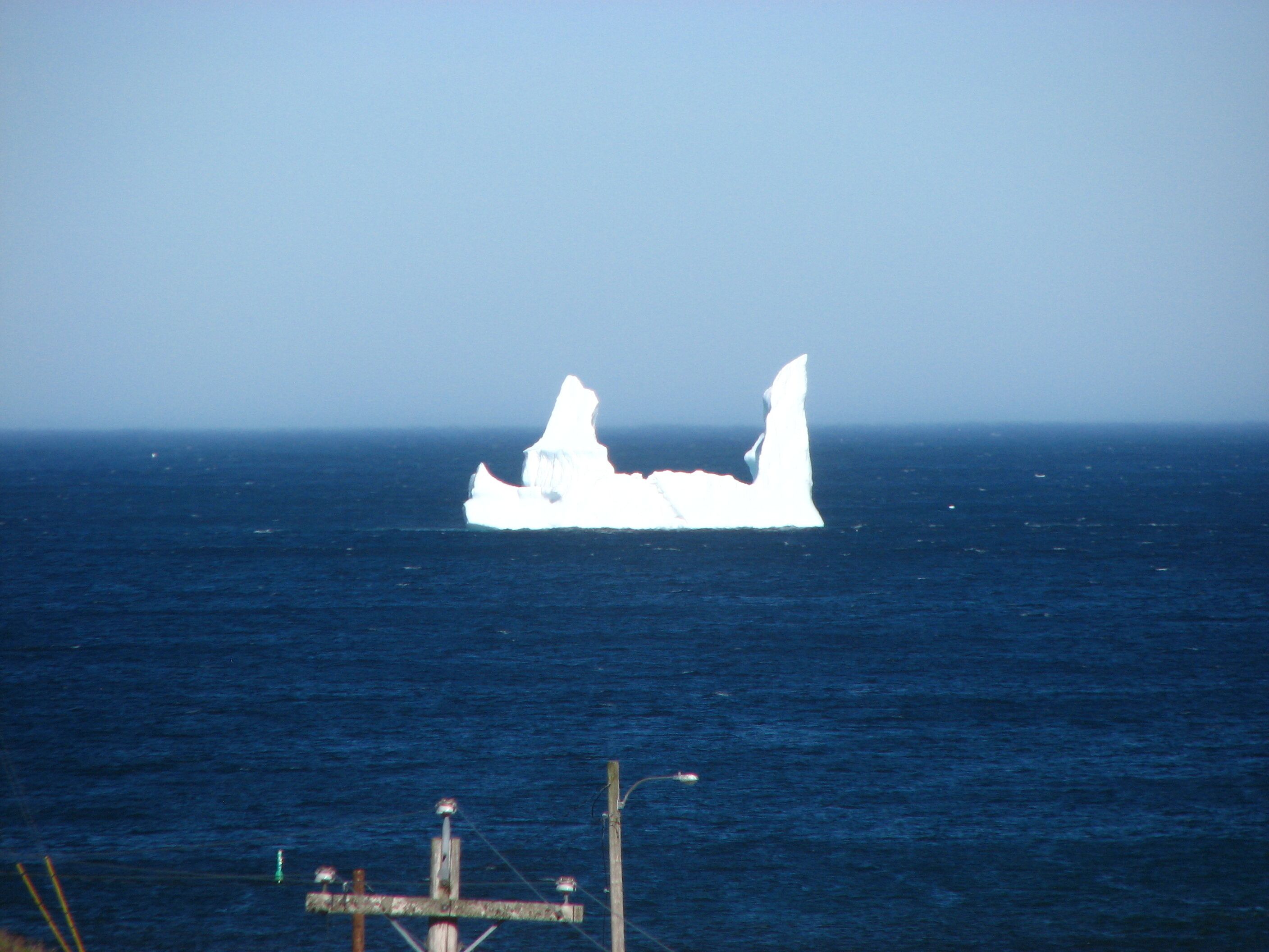 A large iceberg in the ocean.