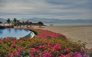 On the beach, sun loungers, beach towels