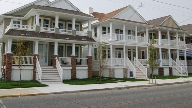 A row of two-story houses with front porches and steps leading to the entrance. - Great Location - Close to Beach, Boardwalk, Asbury Shops and Cafes! (Ocean City)