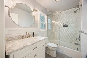 Shower, hair dryer, towels, toilet paper