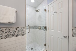 Shower, hair dryer, towels, toilet paper