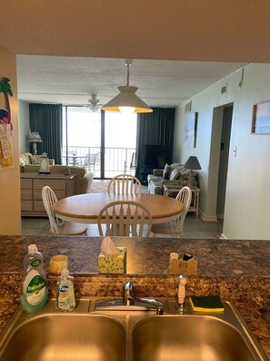 Enjoy meals in the dining area with a flat-screen TV and comfortable seating.