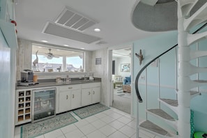 Enjoy a stylish kitchen with a wine cooler and expansive views of the surrounding area.