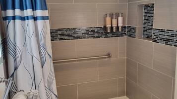 Combined shower/tub, hair dryer, towels, soap