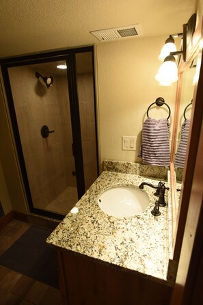 Bathtub, hair dryer, towels, soap
