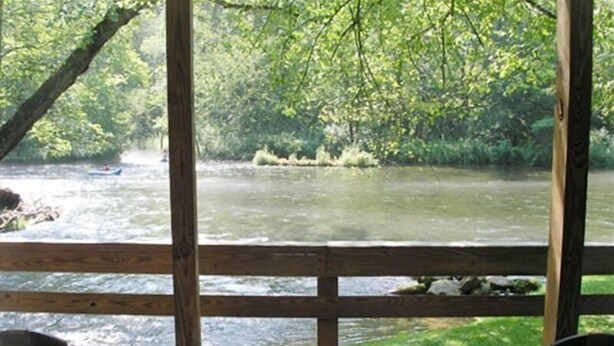 A wooden deck with two chairs facing a river. - RIVERFRONT Cabin on Nantahala River, Minutes from NOC (Nantahala)