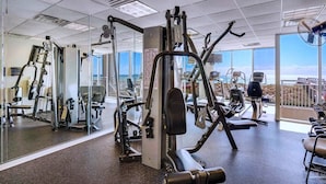 A gym with various exercise machines, large windows, and a view of the ocean. - Relaxin' at The Pearl.
Ocean front condo with direct beach access. (Navarre)