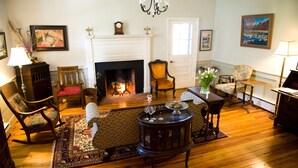 A traditional living room with a fireplace, wooden flooring, and classic furniture. - Hopkins Ordinary Bed Breakfast and Ale Works (Sperryville)