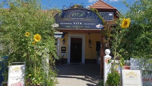A restaurant named 'VITA' with a signboard indicating it offers a restaurant, gelateria, and pizza. - Vita Ristorante Gasthof (Rastenfeld)