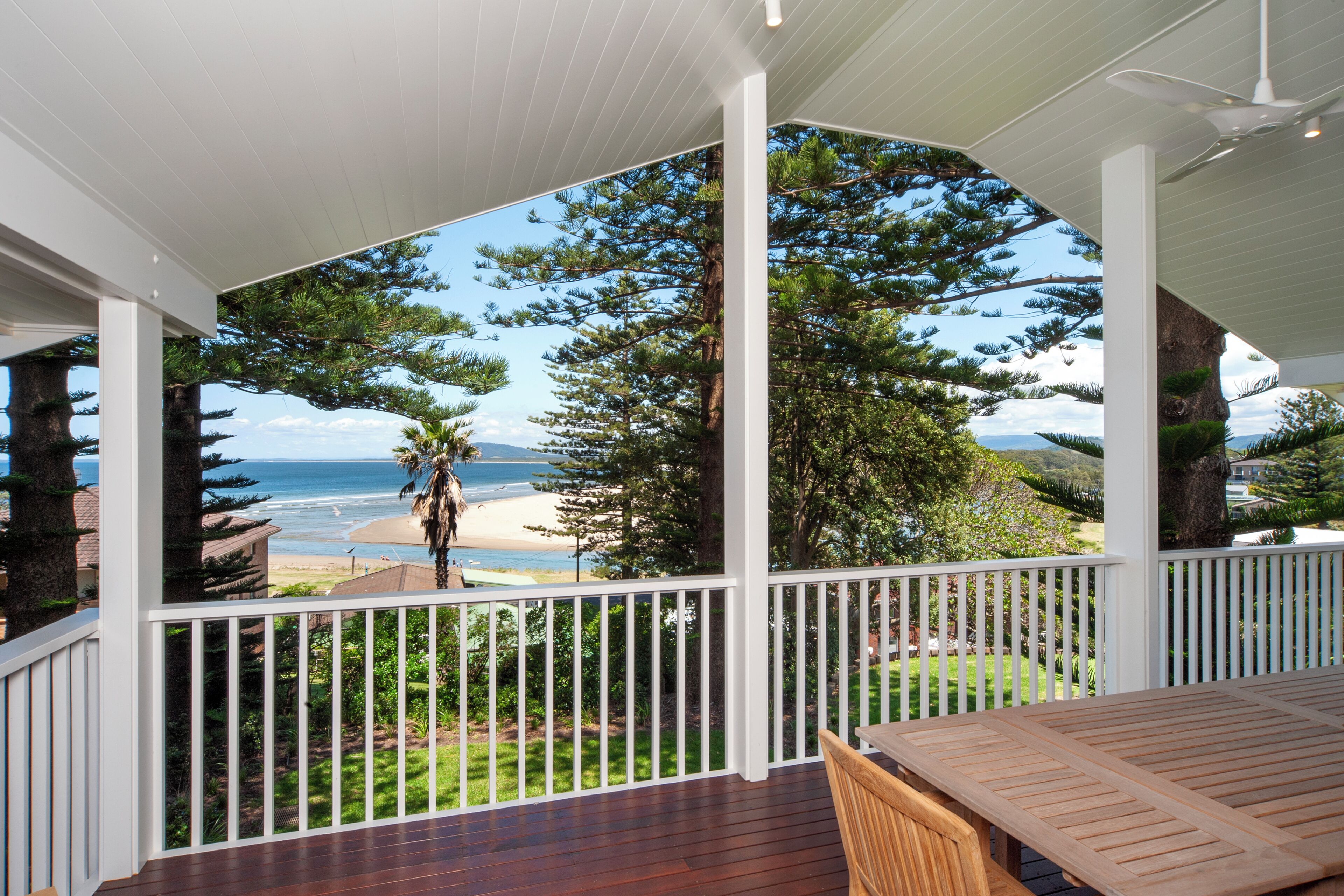 Outdoor dining, bbq and ceiling fan  with view over 7 mile beach, & estuary.