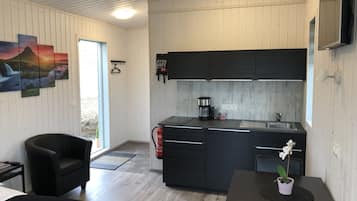 Fridge, microwave, stovetop, coffee/tea maker