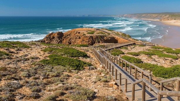 A coastal landscape with a wooden boardwalk leading to a beach. - "Casa da Charca" - SW Alentejano (Odemira)