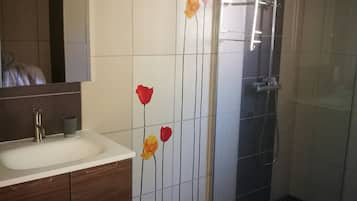 Bathtub, hair dryer, towels, soap