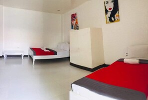 Quadruple Room | Iron/ironing board, bed sheets - Country Inn Hotel Baggao- Main (Baggao)