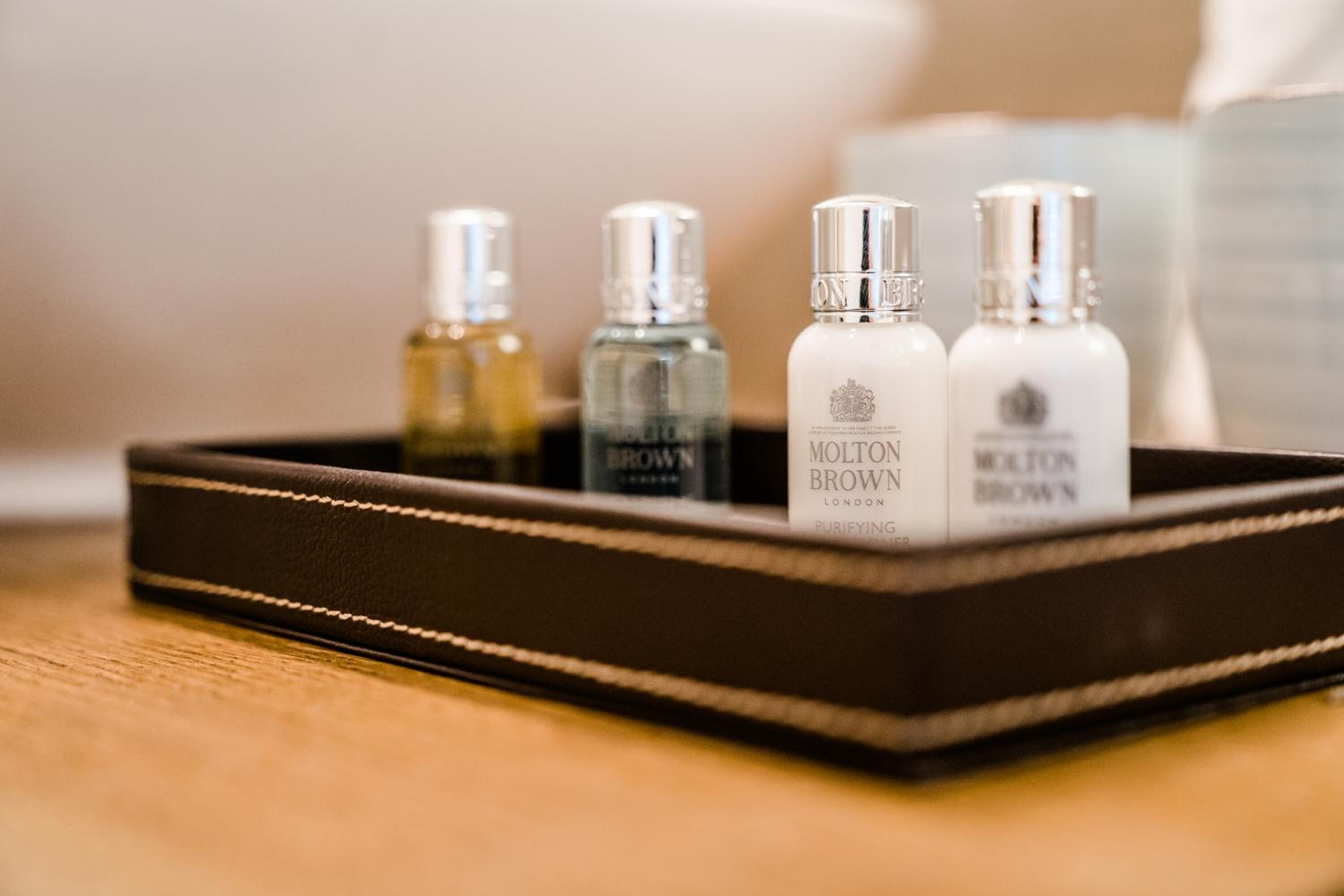 designer toiletries, hair dryer, dressing gowns, slippers