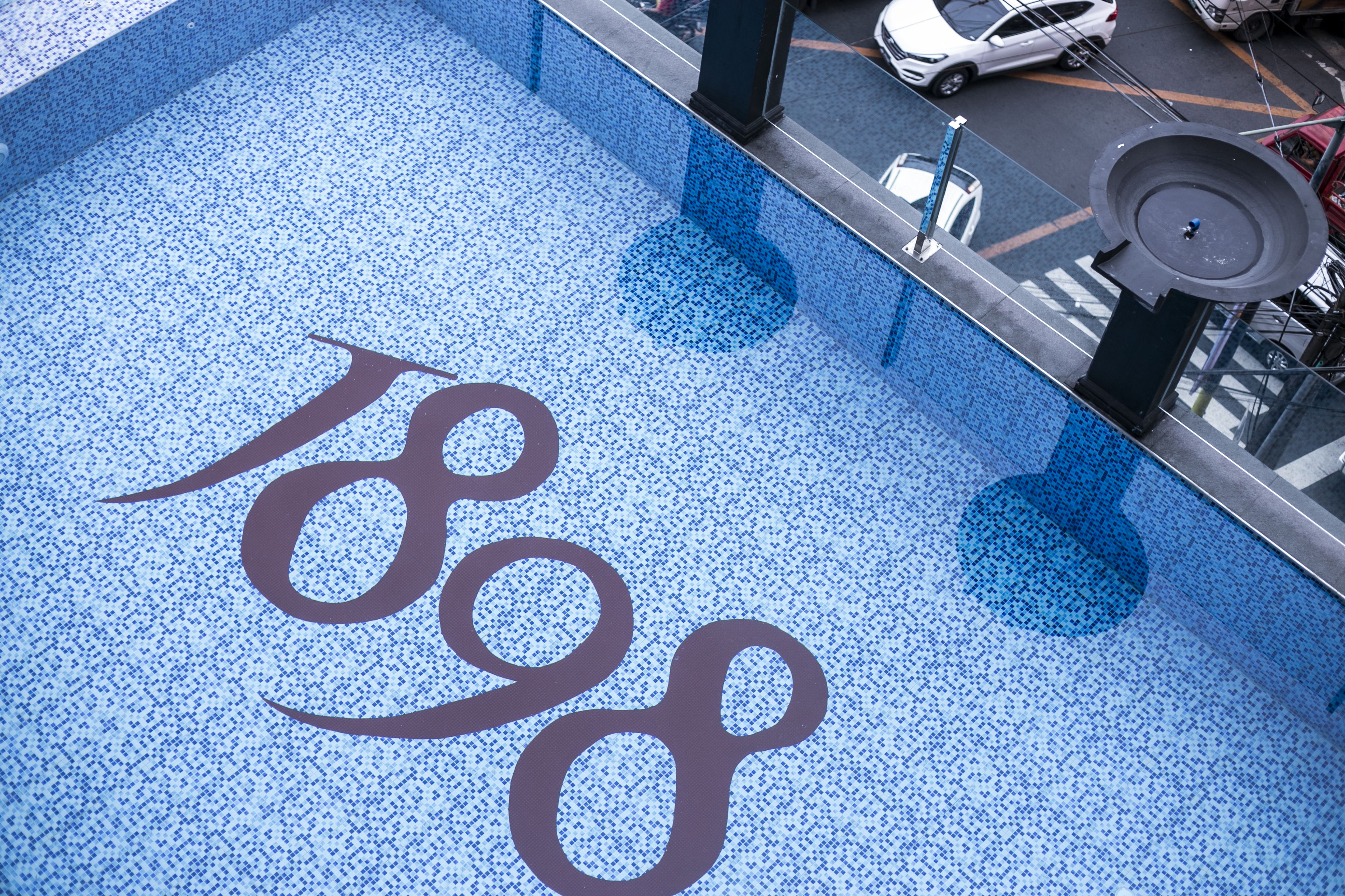 A tiled floor with a large, stylized number '1808' in the center.