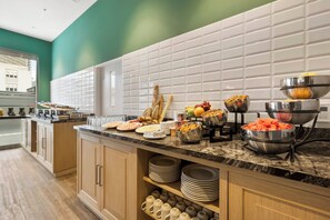 A breakfast buffet with various food items and utensils. - Holiday Inn Express Lima San Isidro by IHG (Lima)