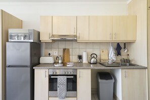 Design Studio Suite, 1 Bedroom | Private kitchen | Full-size fridge, microwave, oven, stovetop - Four Seasons Suite 2 (Cape Town)