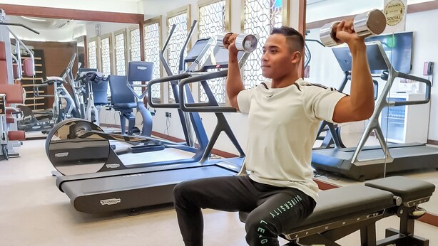 A gym with exercise equipment, including treadmills and weight machines. - Souq Al Wakra Hotel Qatar by Tivoli (Al Wakrah)