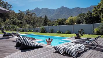 Outdoor pool, pool umbrellas, pool loungers