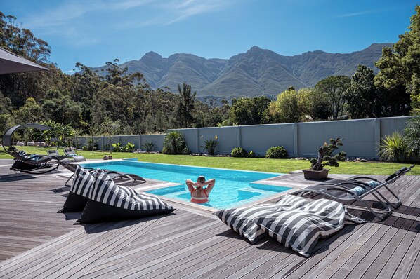 Outdoor pool, pool umbrellas, sun loungers - A Riverbed Guesthouse (Swellendam)