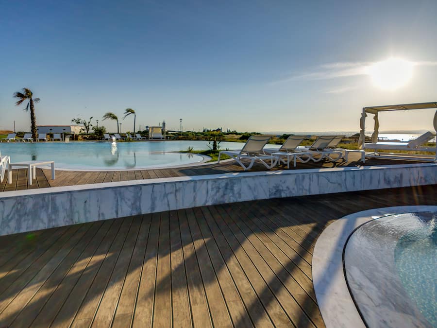 Indoor pool, outdoor pool, pool umbrellas, sun loungers