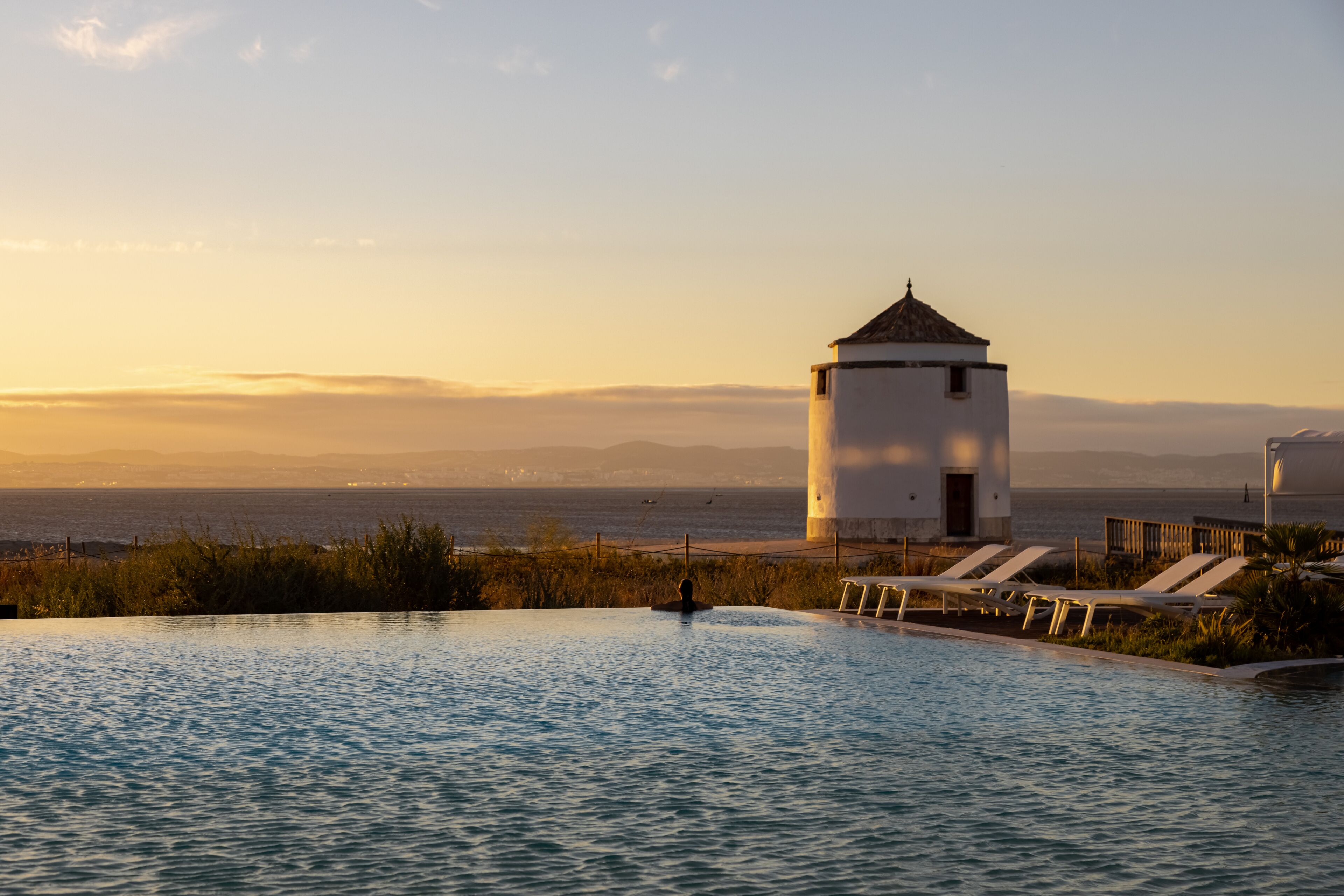 Indoor pool, outdoor pool, pool umbrellas, sun loungers