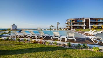 Indoor pool, outdoor pool, pool umbrellas, sun loungers