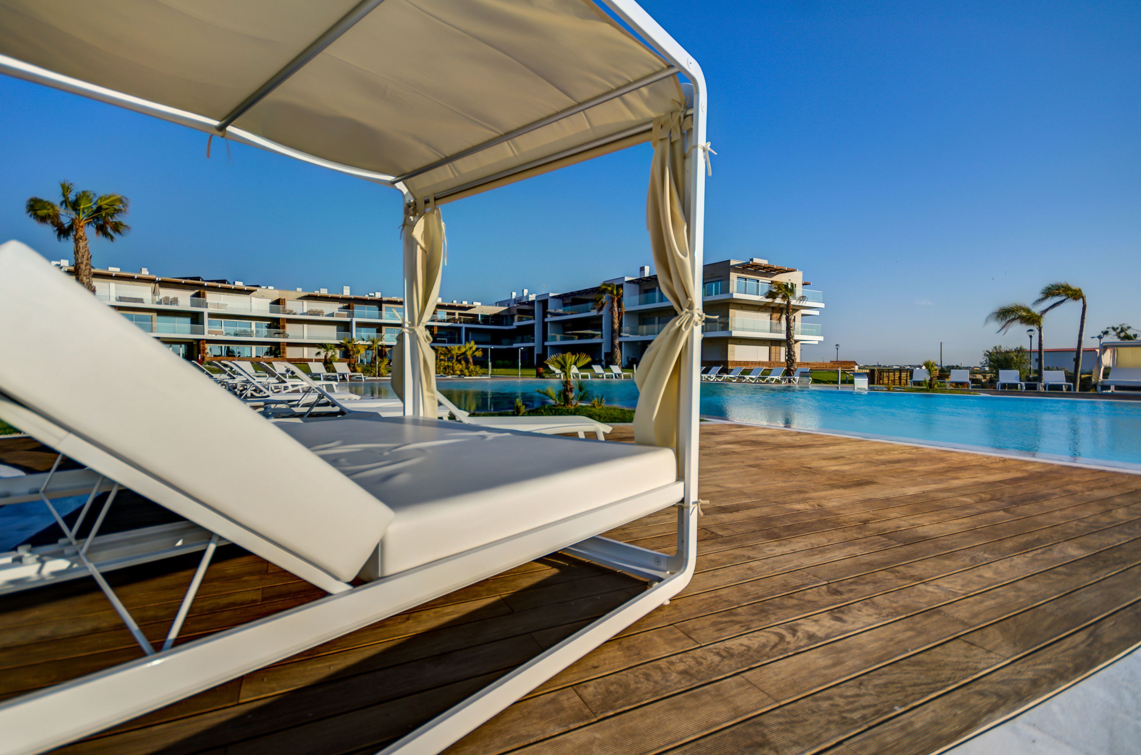 indoor pool, outdoor pool, pool umbrellas, pool loungers