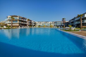 Indoor pool, outdoor pool, pool umbrellas, pool loungers