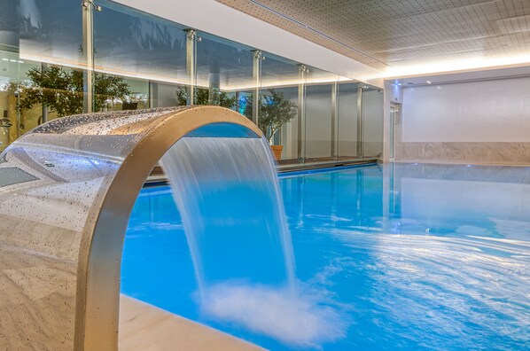 Indoor pool, outdoor pool, pool umbrellas, pool loungers
